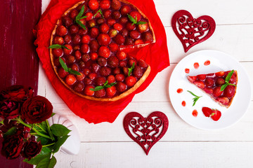 Strawberry pie on white plate and white wooden table. One piece. Top view.  Romantic. Love. Heart.