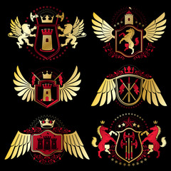 Heraldic vector signs decorated with vintage elements, monarch crowns, religious crosses, armory and animals. Set of classy symbolic graphic insignias with bird wings.