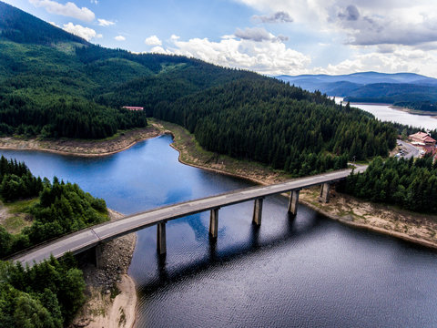 Bridge crossing lake aerial view