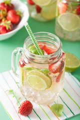 refreshing summer lemonade with strawberry and lime in mason jar