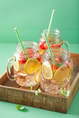 refreshing summer lemonade with strawberry and lime in mason jar