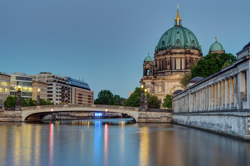 Fototapeta na wymiar The Berlin cathedral at the banks of the river Spree at dusk