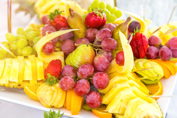 Assorted fruit on white plate