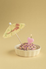 Small birthday cake with heart shaped candle