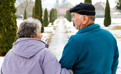 Walking elderly couple