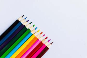 Colored pencils on white background, left