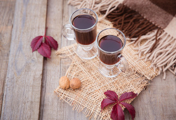 mulled wine hot alcoholic drink with spices garnished autumn leaves space for text