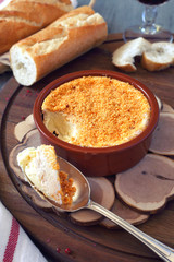Cooking Camembert fondue. Toned image