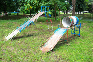Old metal slider at playground