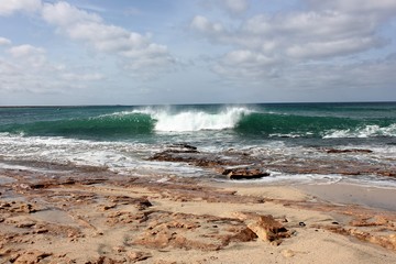 Fototapeta na wymiar Medium wave at beach 