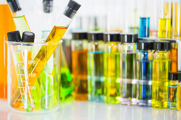 Laboratory glass test tubes with colorful chemical solution in a beaker test tubes and chemical...