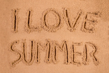 I Love Summer written in soft wet sand on a beach