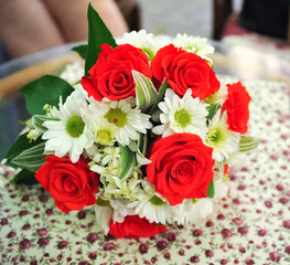 Wedding rings on the background of the wedding bouquet