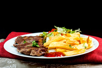juicy steak beef meat with tomato and french fries