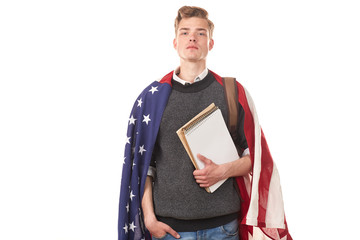 Portrait of male university student with American flag over his shoulders