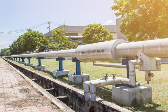 industrial pipes of steam high pressure beside the road in industrial estate,compression,pressure gauge