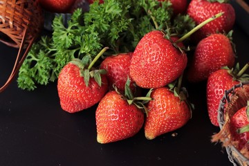 Fresh strawberries is delicious on black background
