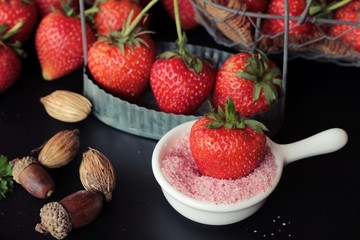 Fresh strawberries is delicious on black background