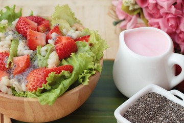 Strawberry salad ingredients, lettuce, chia seeds, barley