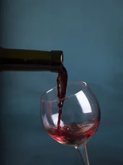 Fotobehang stream of wine being pouring into a glass closeup, wine, splashing, splash, © kishivan