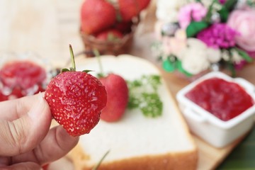 Strawberry jam with slice of bread delicious