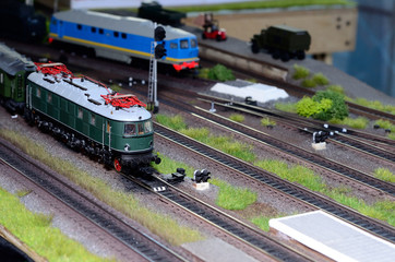 Toy train model on the railway