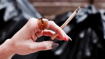 Joint in woman hand