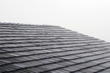 Shake shingles on roof with fog