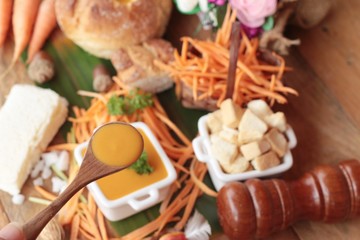 Carrot cream soup with bread is delicious