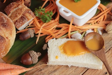 Carrot cream soup with bread is delicious