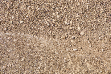 Pebbles on the beach and sea waves