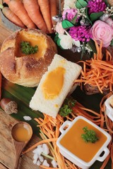 Carrot cream soup with bread is delicious