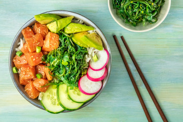 Hawaiian salmon poke salad with wakame and copy space