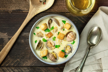 Bowl of clam chowder soup, overhead shot, with copy space