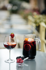 Delicious Red Sangria with fruits on table