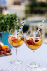 Delicious Red Sangria with fruits on table