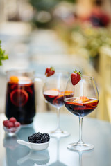 Delicious Red Sangria with fruits on table