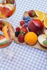 Delicious Red Sangria with fruits on table