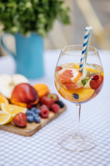Delicious Red Sangria with fruits on table
