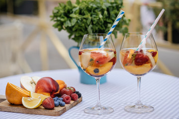Delicious Red Sangria with fruits on table