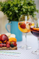 Delicious Red Sangria with fruits on table