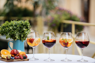 Delicious Red Sangria with fruits on table