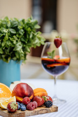 Delicious Red Sangria with fruits on table