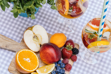 Delicious Red Sangria with fruits on table