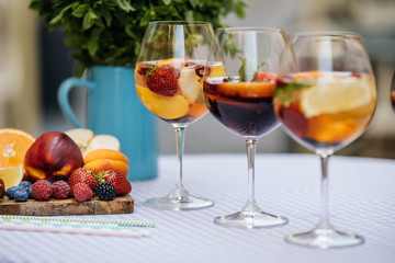 Delicious Red Sangria with fruits on table