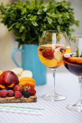 Delicious Red Sangria with fruits on table