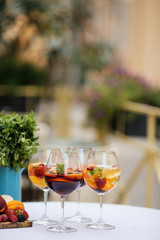 Delicious Red Sangria with fruits on table