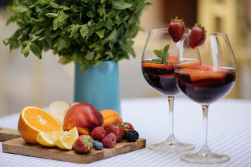 Delicious Red Sangria with fruits on table