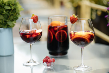 Summer drink Sangria with orange and cranberry. Selective focus. Copy space