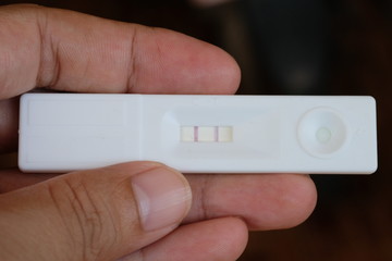 pregnant test in hand or pregnant test in hand background